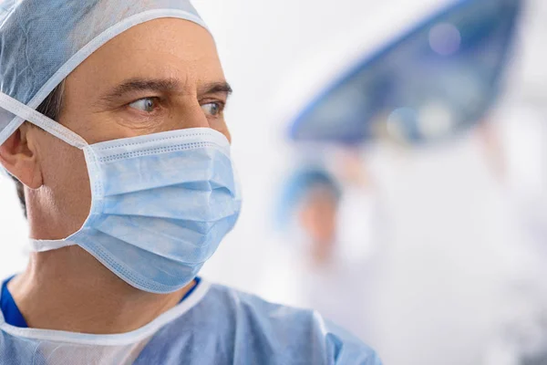 Male medical person glancing curiously — Stock Photo, Image