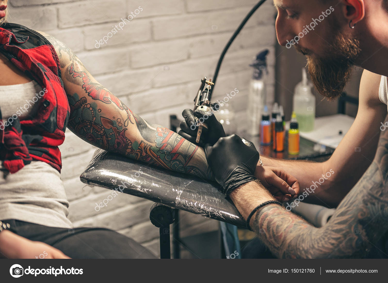 depositphotos_150121760-stock-photo-calm-man-making-tattoo-on.jpg