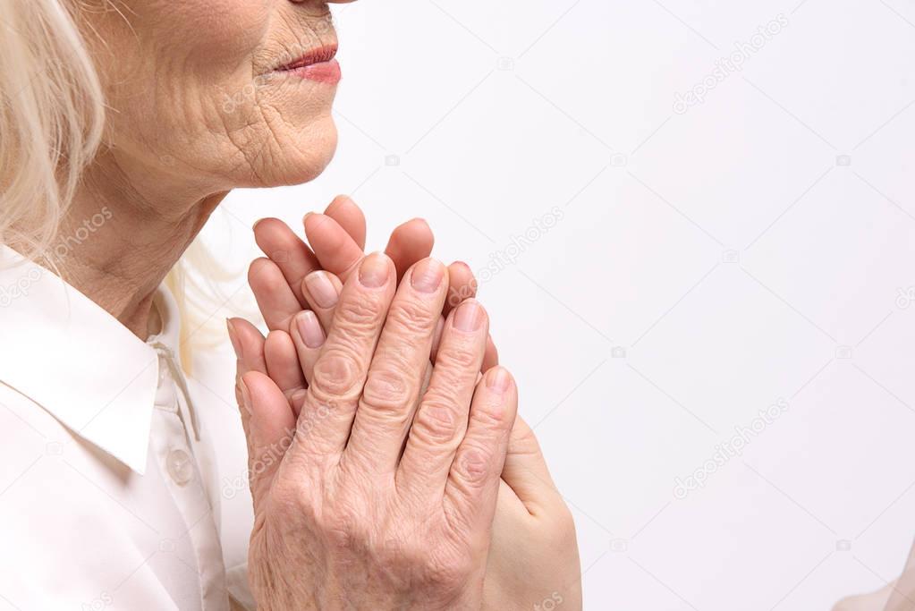 Old female person keeping arms