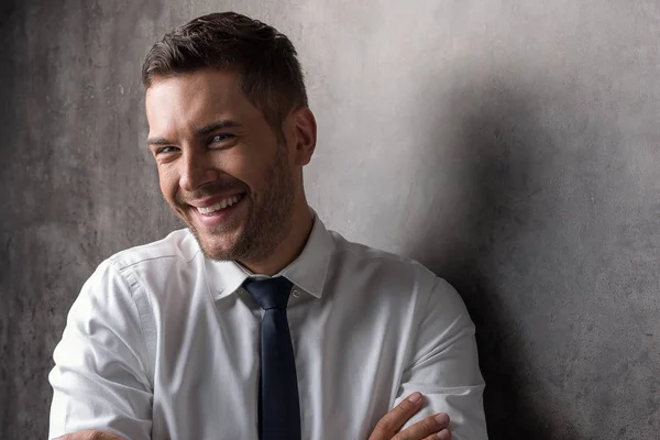 Elegant young businessman laughing with happiness — Stock Photo, Image