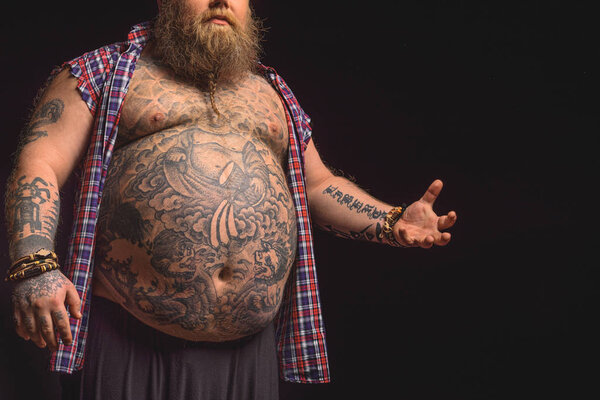 Male fatso with big tattooed abdomen