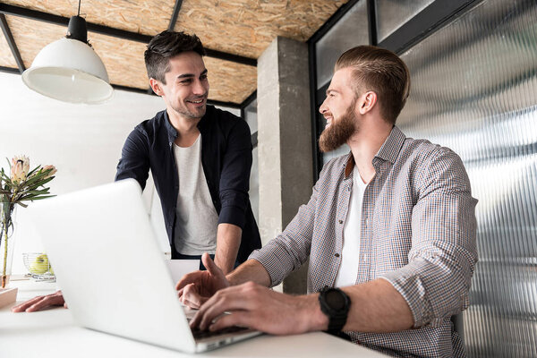 Hilarious male colleagues in bureau