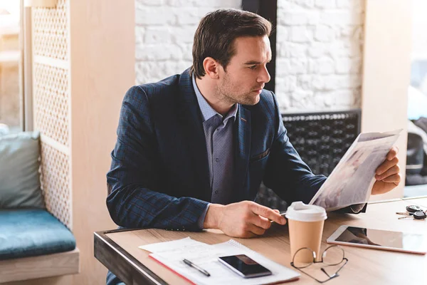 Calm male looking at newspaper — Stock Photo, Image