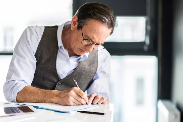 Confident mature man working in office — Stock Photo, Image