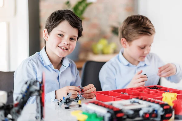 Cheerful male children in workshop — Stock Photo, Image