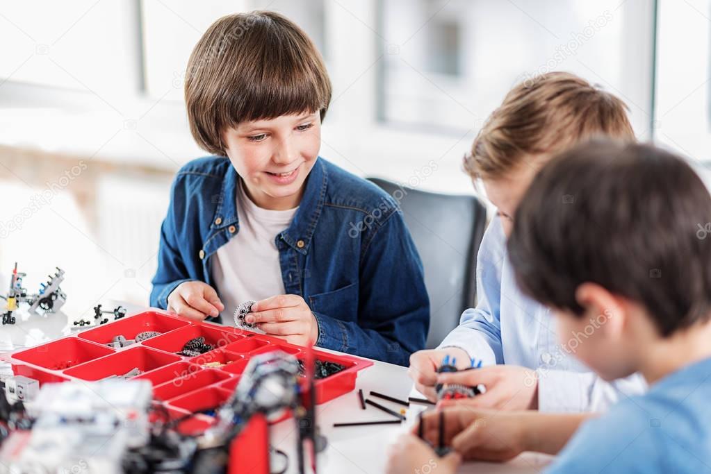 Cheerful children using small details