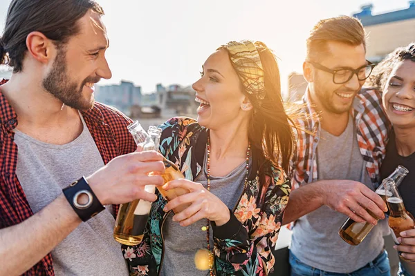 Positive young men and women celebrating event together — Stock Photo, Image