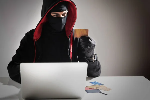 Serene thief robbing from notebook computer