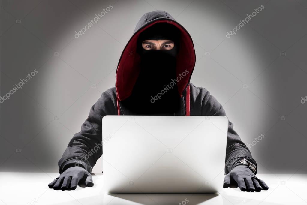 Serious hacker stealing information from laptop