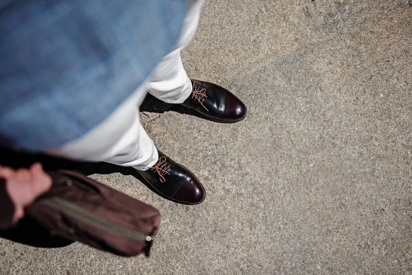 Accurate male person keeping bag — Stock Photo, Image