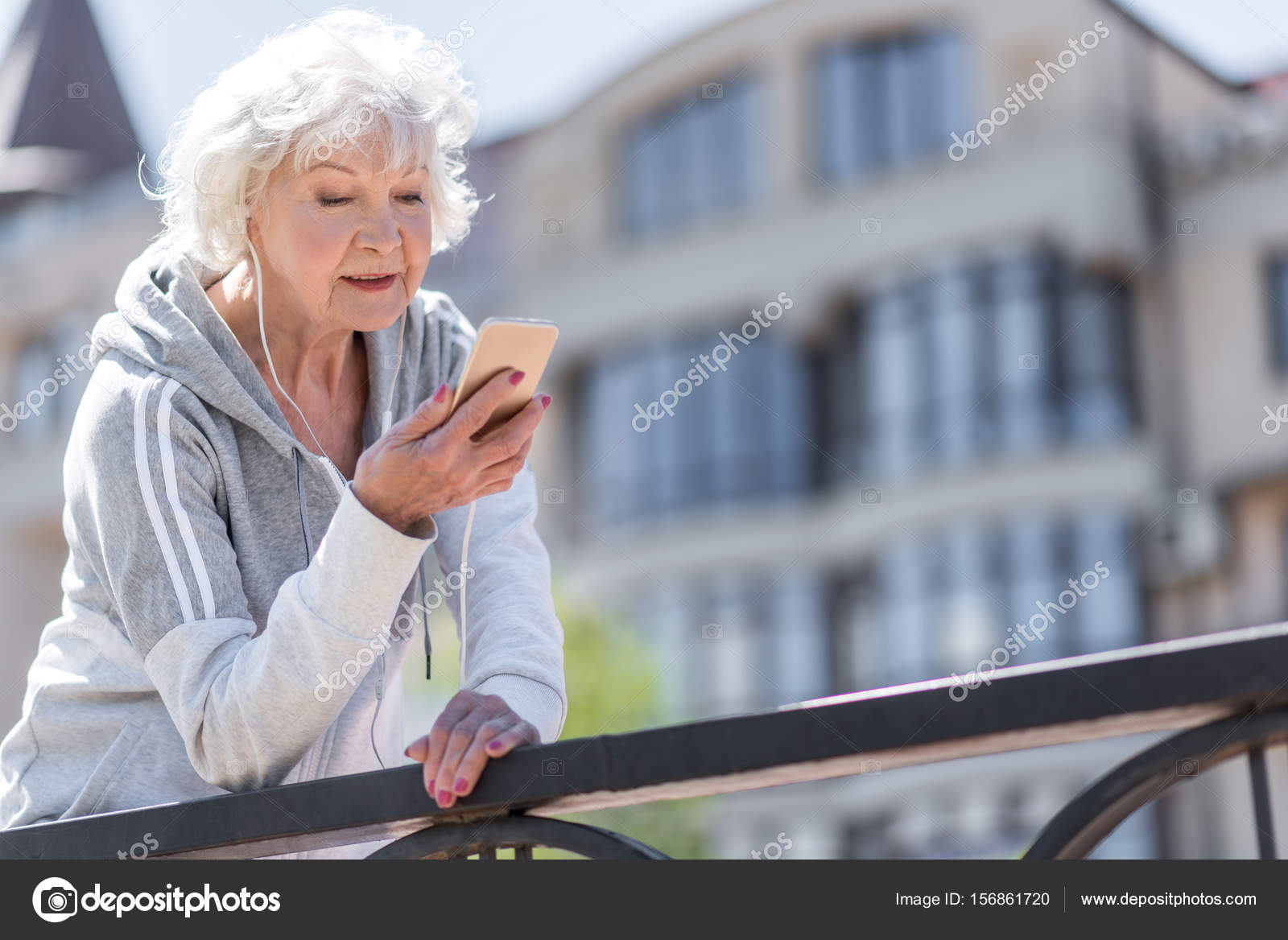 Happy Nice Elderly Woman Having Relax Time While Exercising Outdoors Stock Photo Happy Nice Elderly Woman Having Relax Time While Exercising Outdoors Stock Photo