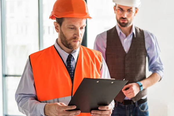 Busy concentrated foremen in room — Stock Photo, Image