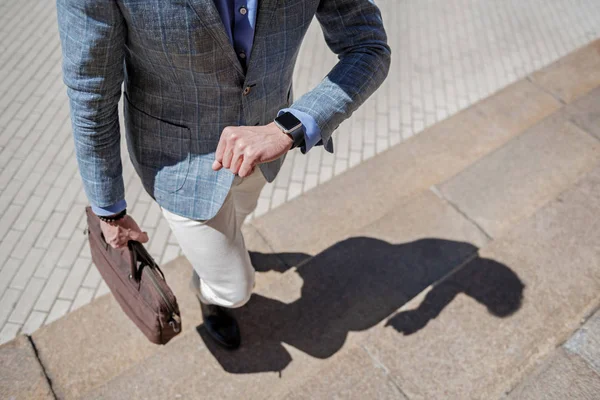 Busy male person using watch — Stock Photo, Image