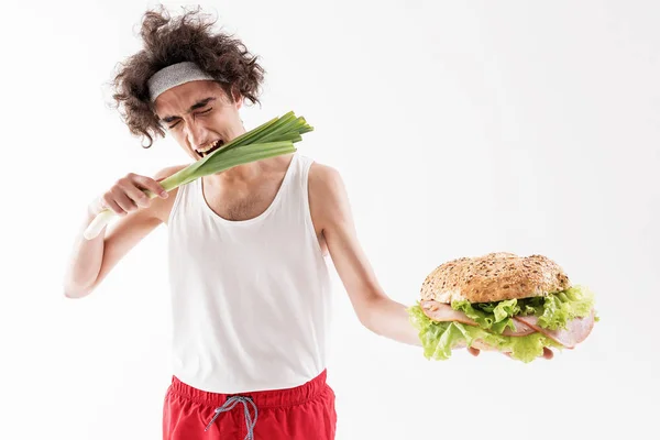 Starving thin man has to eat vitamins — Stock Photo, Image