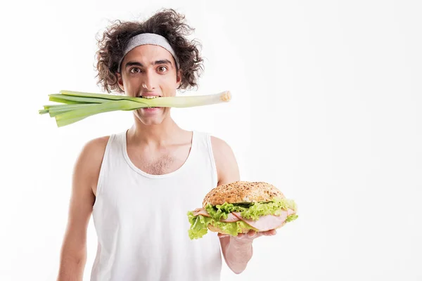Thin guy sitting on vegetable diet — Stock Photo, Image