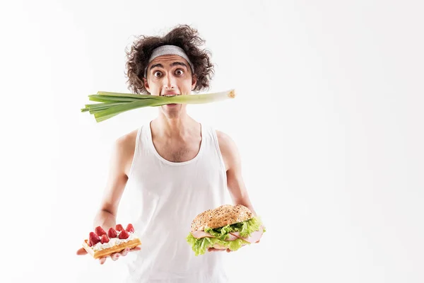 Starving thin guy choosing healthy eating — Stock Photo, Image