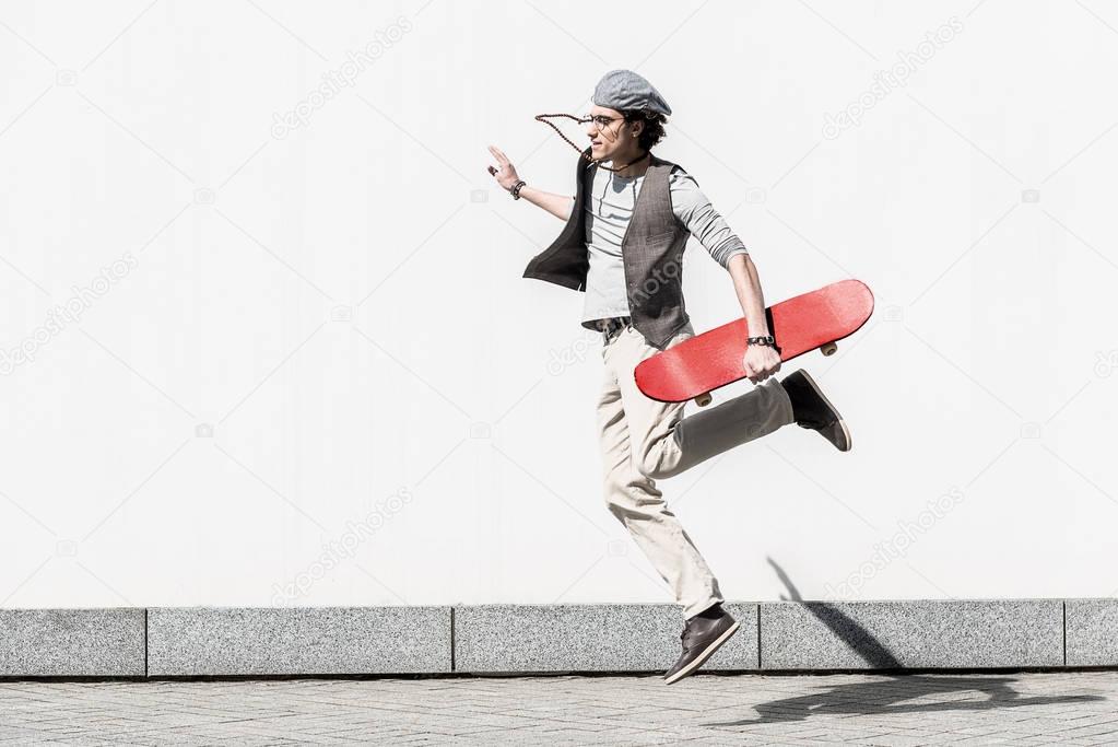Active teenager is spending time on street dynamically