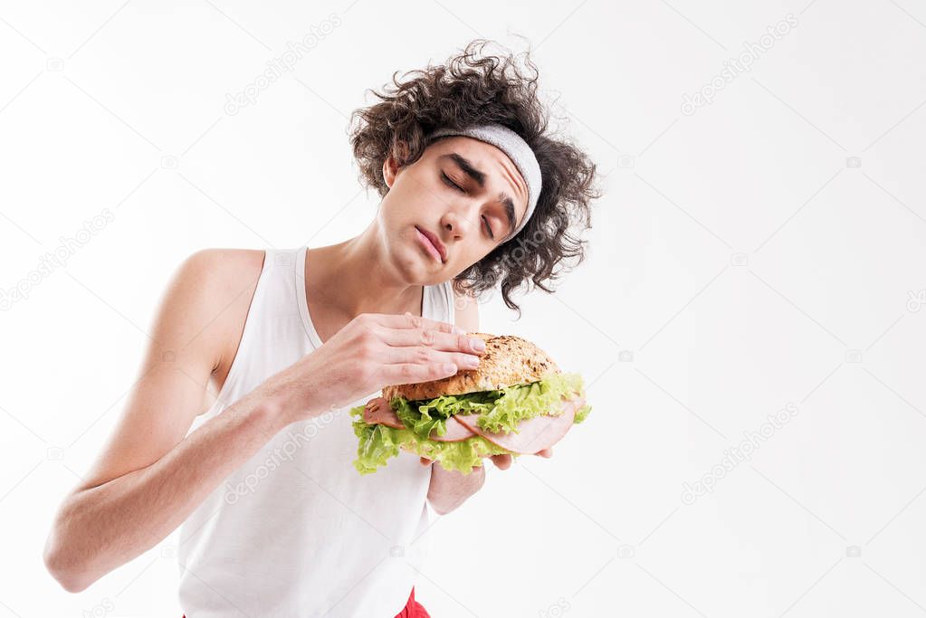 Skinny guy is seduced by unhealthy food