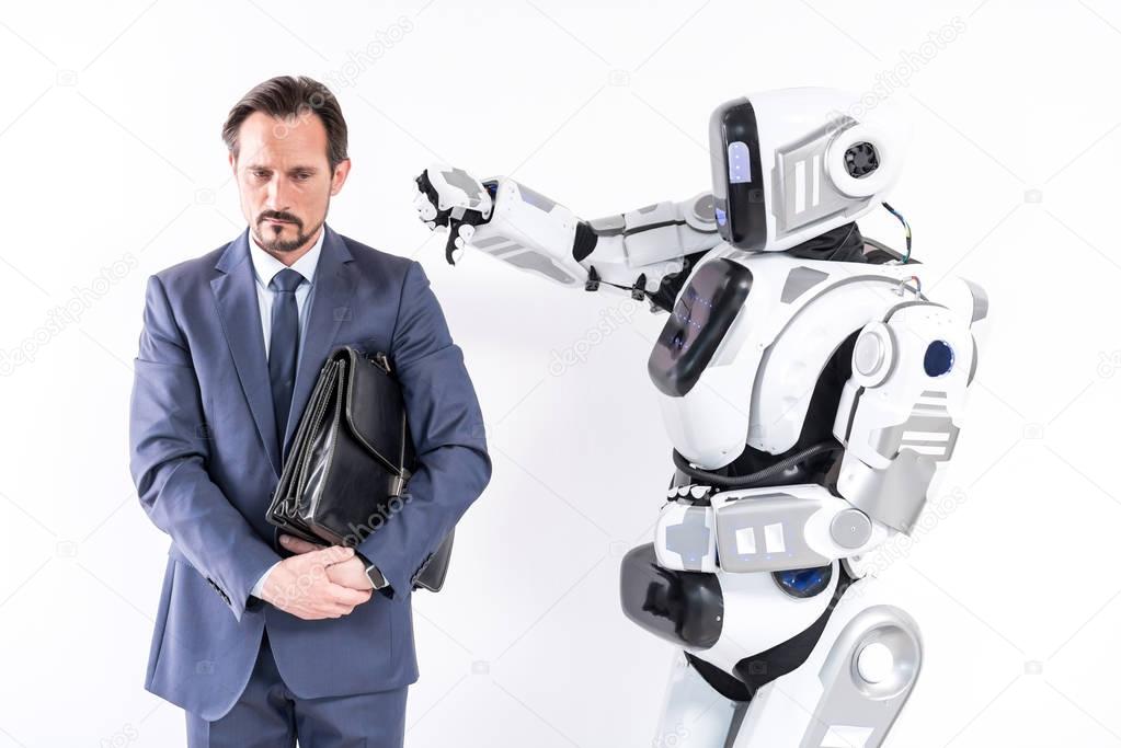 Mature man is expressing grievance because of aggressive robot