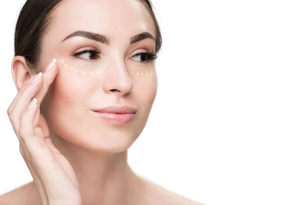 Cheerful young lady using concealer — Stock Photo, Image