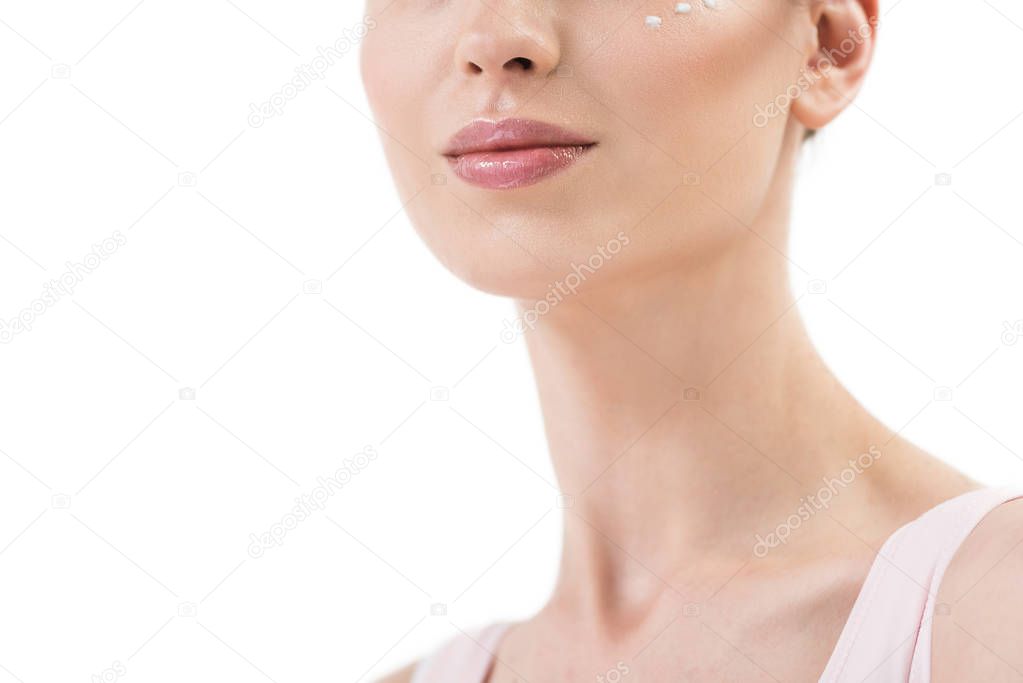 Half of face of youthful happy lady using cosmetics