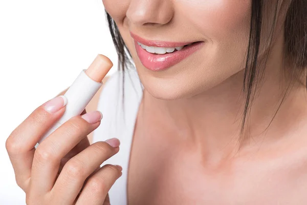 Vrolijk meisje met hygiënische lippenstift — Stockfoto
