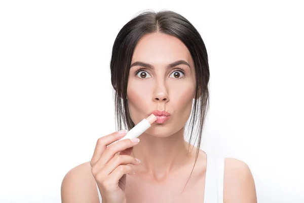 Shocked girl doing healthy facial make-up — Stock Photo, Image