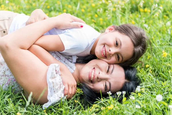 Carefree mother hugging her child with love — Stock Photo, Image