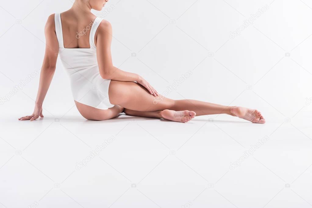 Young girl gymnast recreating after exercise