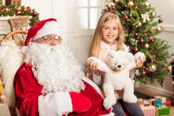 Joyful kid celebrating New Year with old man — Stock Photo, Image