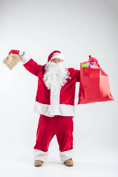 Excited senior Santa holding many presents — Stock Photo, Image