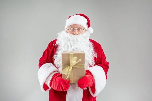 Excited mature Santa keeping present — Stock Photo, Image