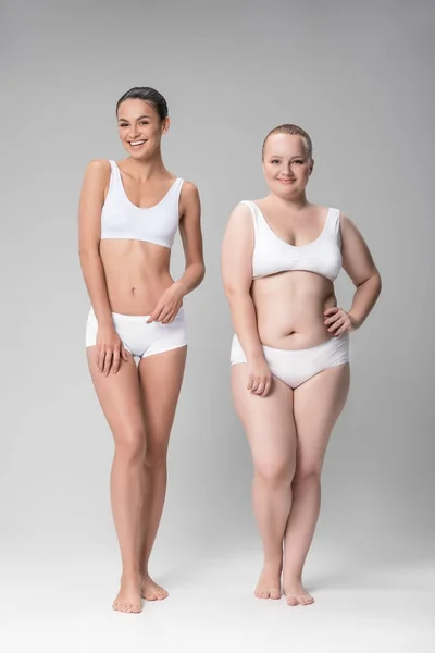 Happy Young Fat And Fit Women Standing In Underwear Stock Photo Happy Young Fat And Fit Women Standing In Underwear Stock Photo