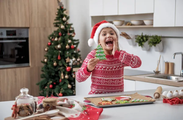 Joyful little girl having fun in kitchen on holiday — Stock Photo, Image