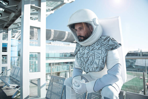 Mindful male astronaut in wait