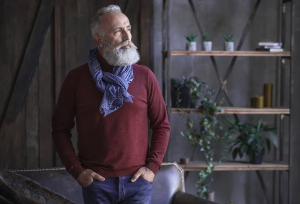 Serene beard retire male standing in apartment — Stock Photo, Image