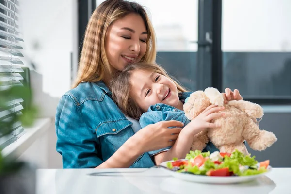 Carefree family having fun in kitchen — Stock Photo, Image