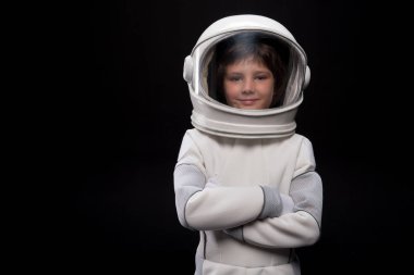 Cute child astronaut is posing confidently clipart