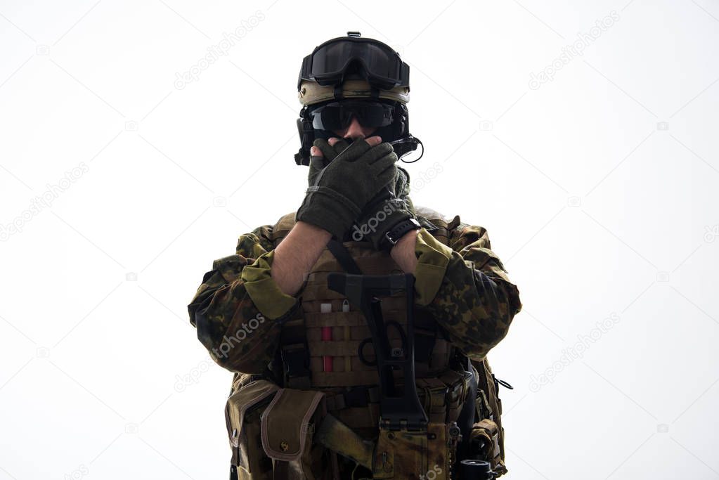 Male defender in ammunition keeping silence