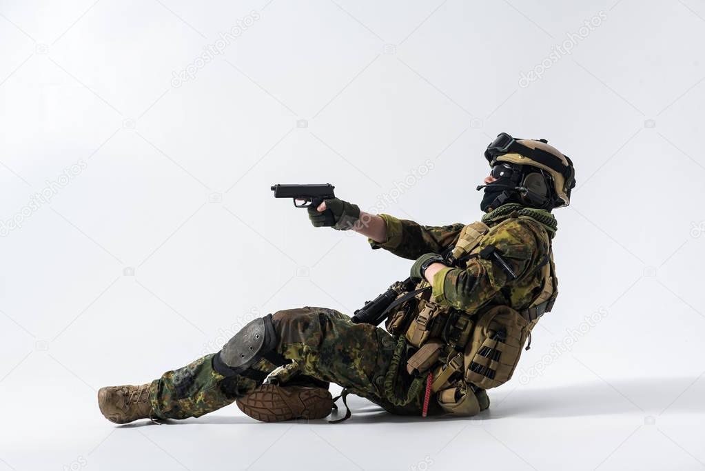 Soldier in ammunition firing pistol