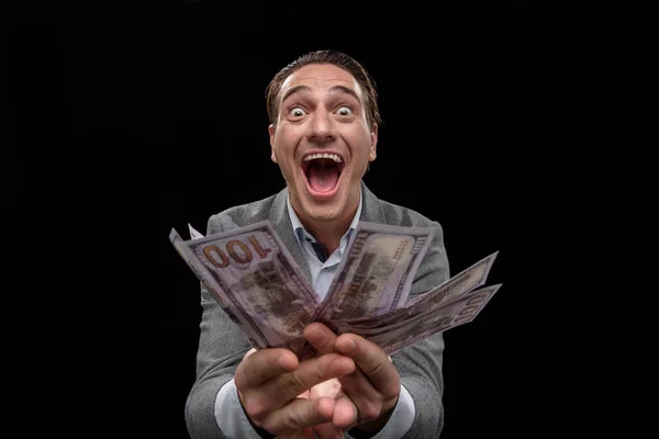 Erwachsener Geschäftsmann zeigt sich von Bargeld besessen — Stockfoto