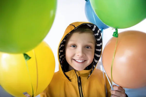 Contented little boy with air balloons — Stock Photo, Image