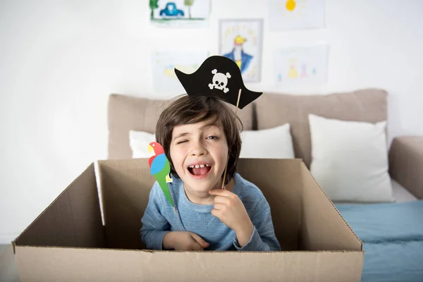 Happy little pirate playing indoors