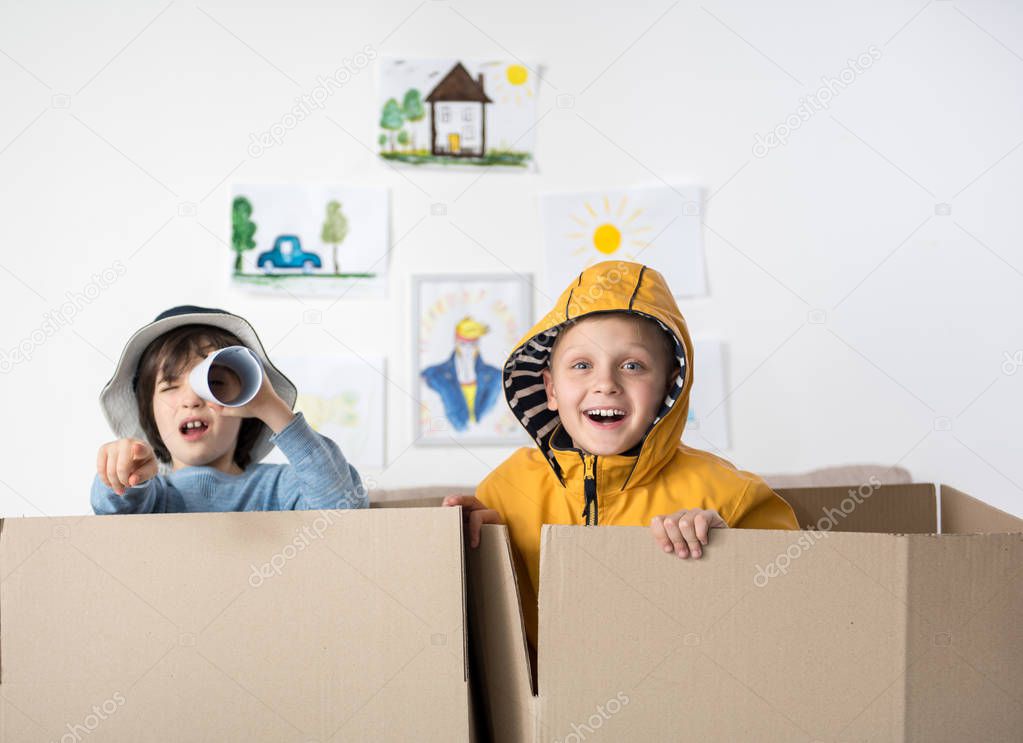 Joyful young boys playing at home