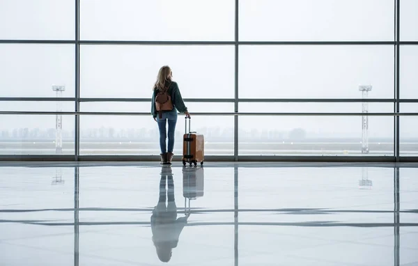 Lonely woman going abroad to begin a new life