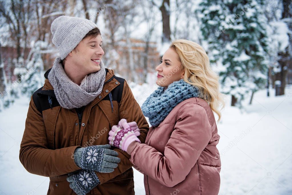 Carefree loving couple dating in winter park