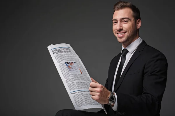 Happy worker looking trough article — Stock Photo, Image