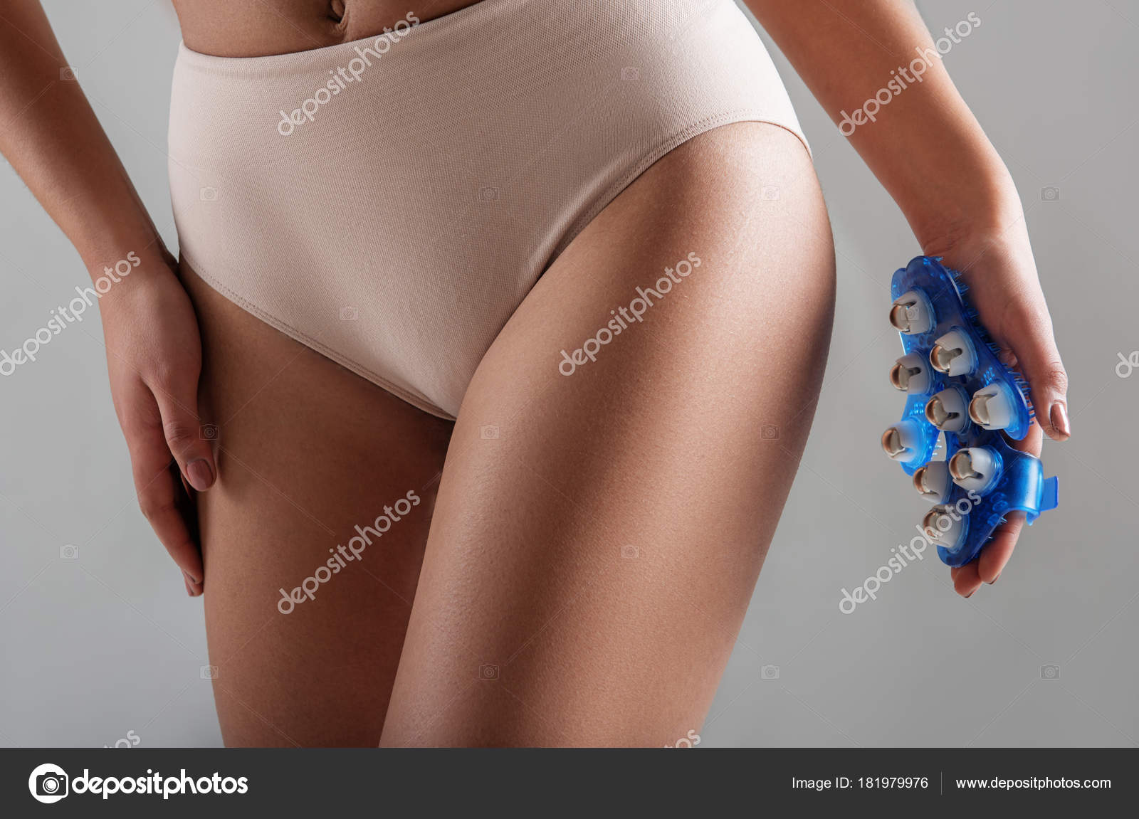 Close Up Of Female Hand Holding Hand Massager Close To Backsides Woman Is Taking Care Of Her Slender Body Isolated On Background Photo By Close Up Of Female Hand Holding Hand Massager Close To Backsides Woman Is Taking Care Of Her Slender Body Isolated On Background Photo By