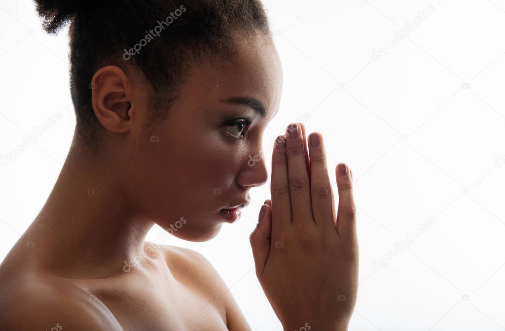 Quiet woman reading a prayer