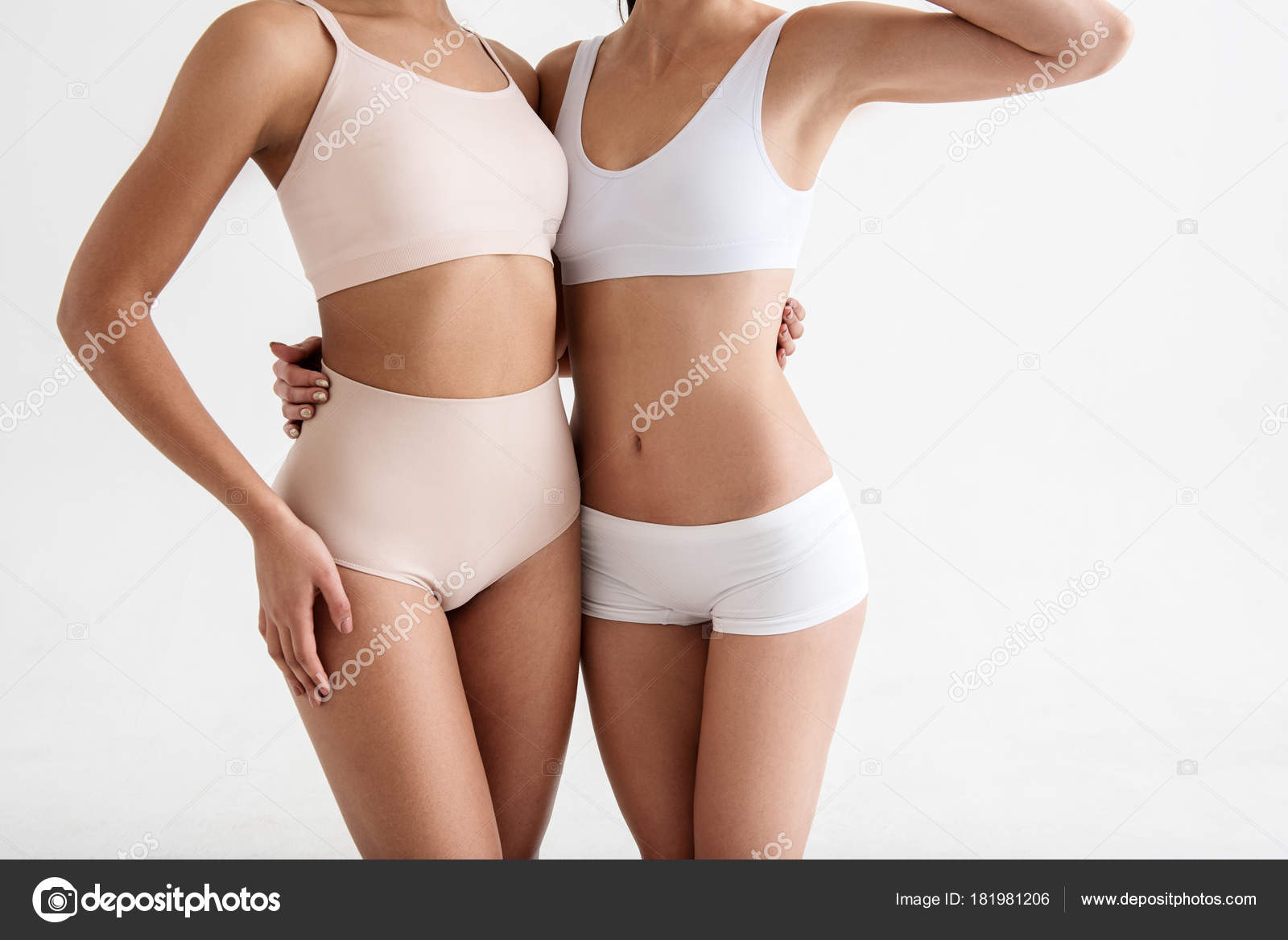 Skinny lady posturing in tight underwear Stock Photo by